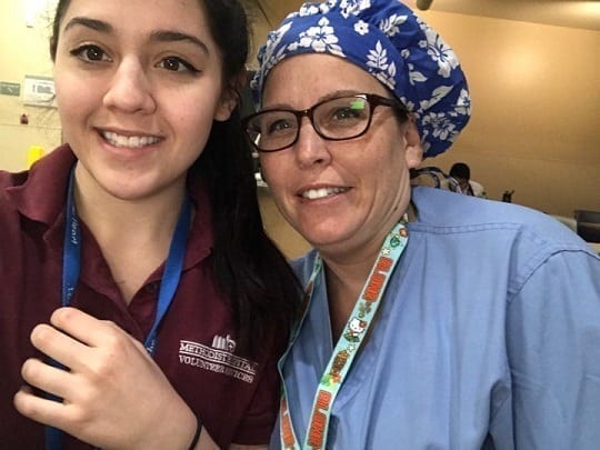 Muay Thai Kickboxing Student of the Month Tina Austin with her daughter in scrubs