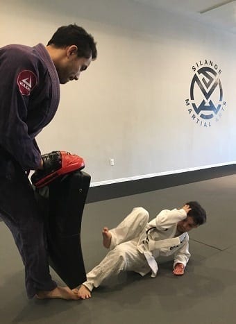 BJJ Kids student showing the technical standup at Silanoe