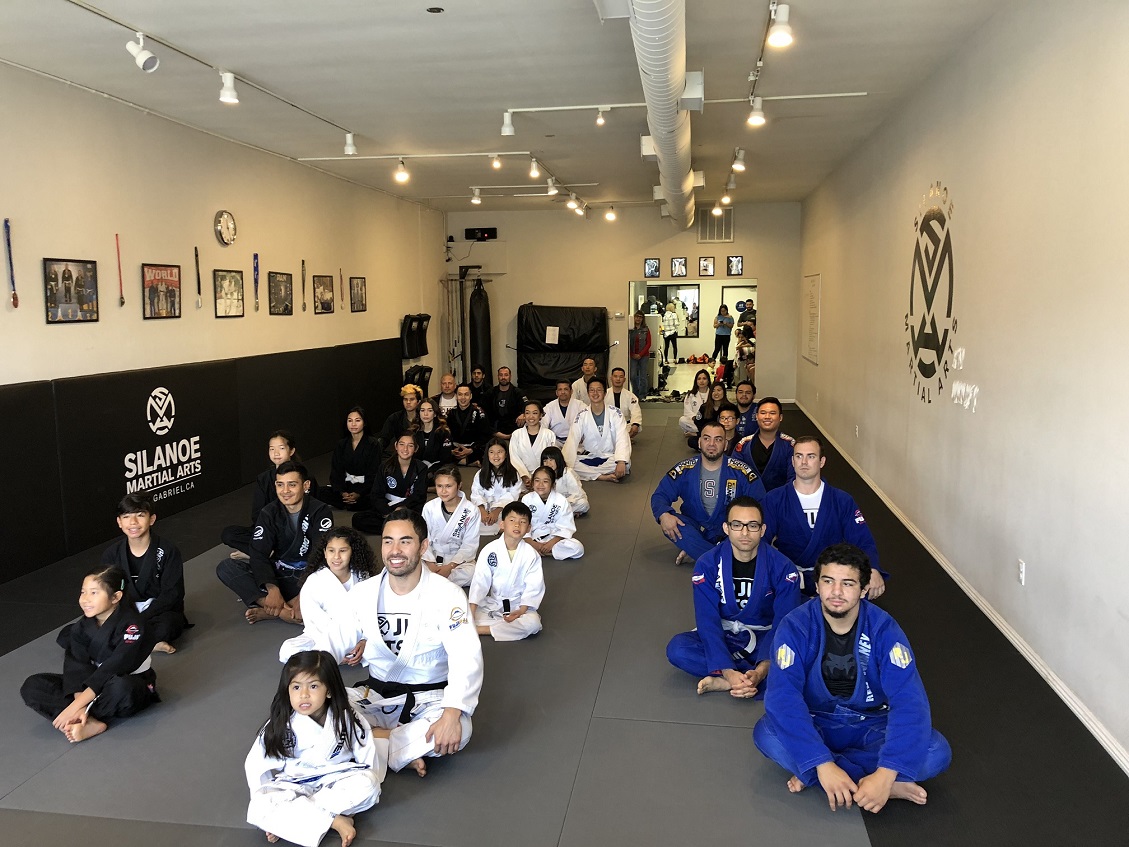 Professor Gino with the Jiu-Jitsu kids and adults at the belt promotion ceremony