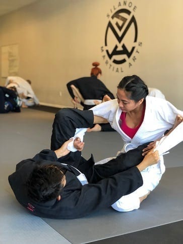 Student of the Month Nikki and Rebecca with a Lass and Spider BJJ technique