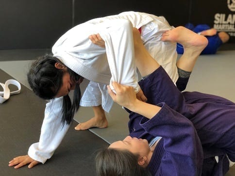 Anna and Nikki practicing their BJJ Spider Guard Sweeps at the Alhambra adjacent studio
