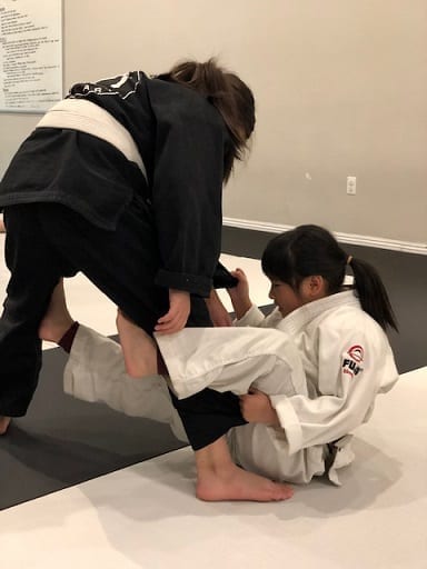 Noelle and her sister in the Jiu-Jitsu program at Silanoe San Gabriel Alhambra