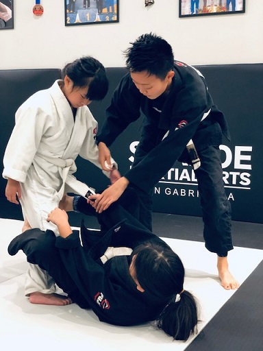 Rebecca helps assist the Silanoe BJJ Kids 2 class in San Gabriel Alhambra