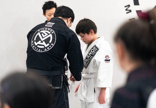 Jaelen promoted by Professor Gino at the Silanoe Martial Arts belt promotion ceremony in San Gabriel Alhambra adjacent studio.
