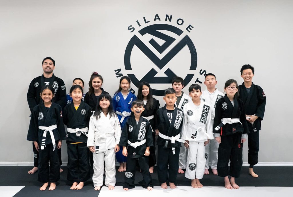 Bella together with fellow Kids 2 BJJ students in a group picture