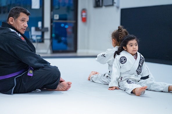 Chelsea and Lola are ready to spar under the watchful eye of coach Chris in the San Gabriel Alhambra adjacent Silanoe Martial Arts location.