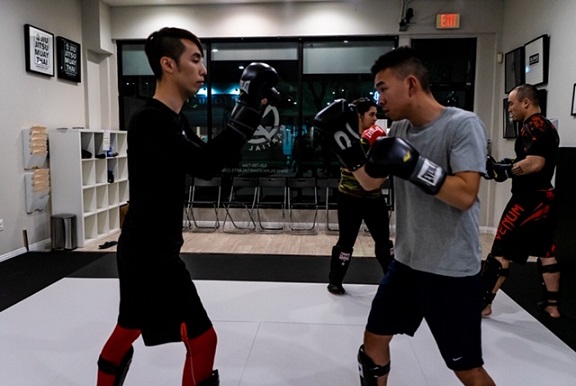 Ivan training with Denny at the Muay Thai Kickboxing class