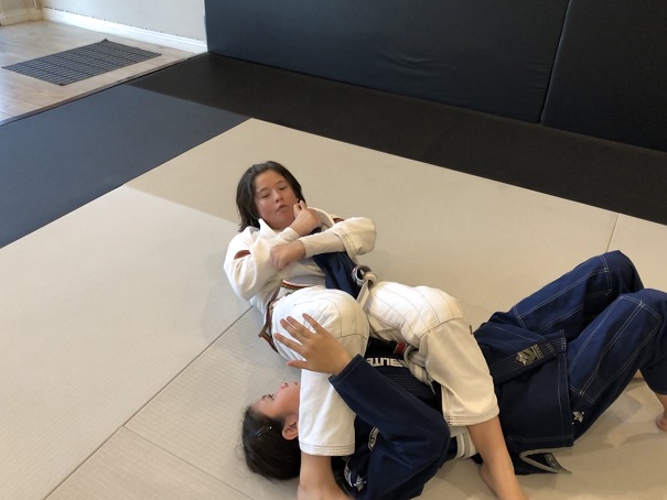 Sasha attacking the armbar in the Kids 2 BJJ class at Silanoe Martial Arts