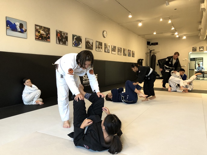 Sasha Gracia using Jiu Jitsu guard passing at the kids Martial Arts program Silanoe San Gabriel 