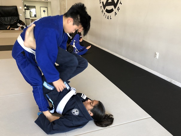 Ally M. practicing the double ankle sweep knocking her training partner down to the mat. A great Self-Defense technique shown at our San Gabriel Alhambra location.