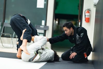 Professor Gino correcting the teens and adults in the Fundamentals BJJ Class