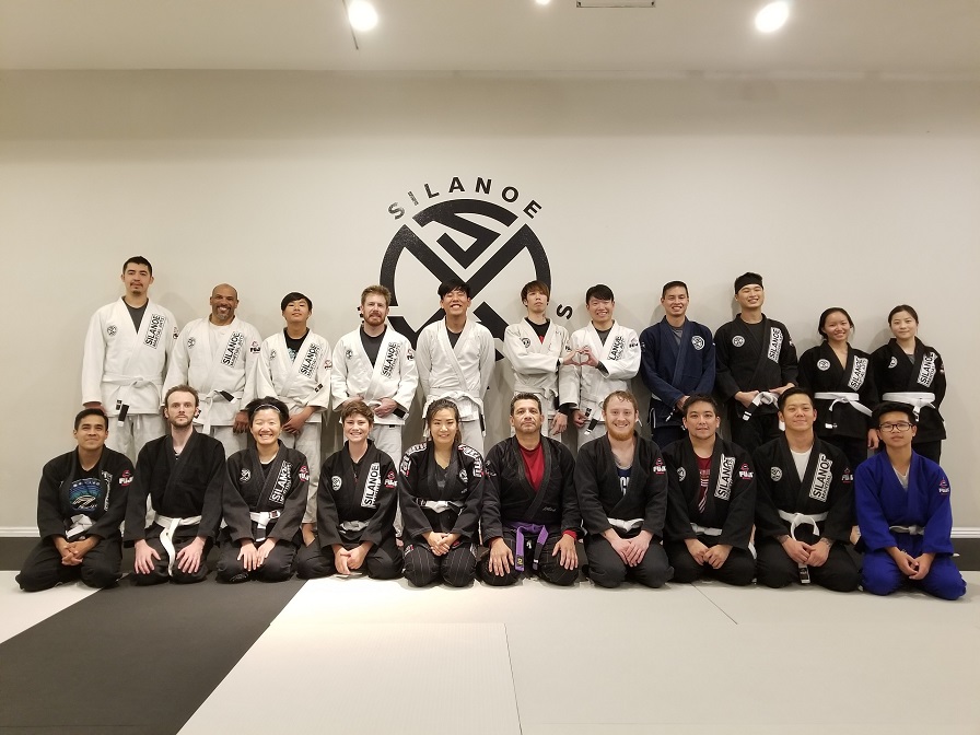 A more recent picture of the Wednesday evening 7 PM BJJ Fundamentals group with Sean Lee in the rear on the right lead by coach Chris. 