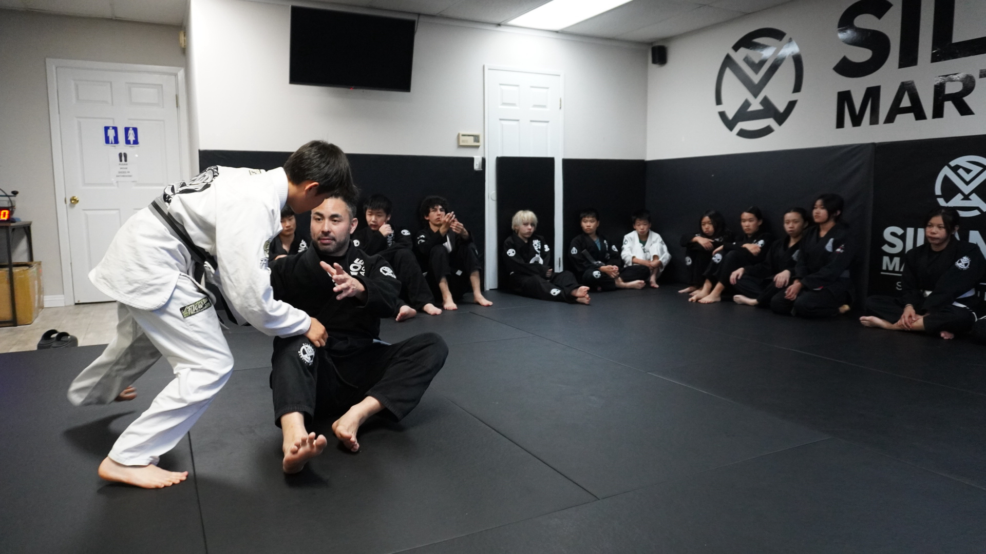 Coach Gino working on the seated guard at the Teens Jiu-Jitsu program at Silanoe Martial Arts in San Gabriel